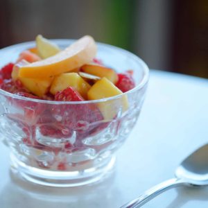 apricots nectarines strawberries and raspberries in a class cup