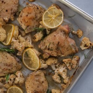 roasted lemon rosemary chicken and cauliflower on a sheet pan