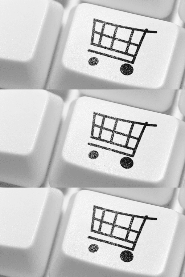 Three indentical drawings of an online shopping cart drawn on keyboard keys